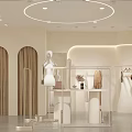 Modern Clothing Store Interior With White Reception Desk Clothing Racks Mannequin And Green Plants