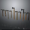 Various Axes With Different Heads And Wooden Handles Arranged In A Row