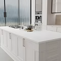 Modern Open Kitchen Featuring White Island Countertop Gas Stove And Cabinets
