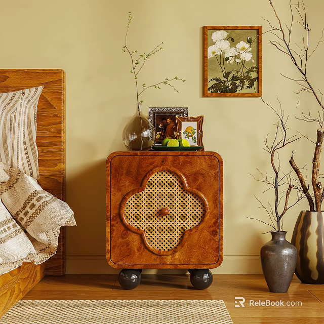 Wooden Bedside Table Featuring Clover Rattan Detail With Vase Photo Frame And Small Plant 3d model 