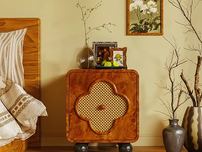 Wooden Bedside Table Featuring Clover Rattan Detail With Vase Photo Frame And Small Plant 3d model