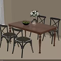 Wooden Dining Table With Four Black Chairs And Fruits In Vase With White Flowers
