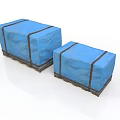 Two Blue Fabric Covered Boxes With Black Straps And Wooden Bases