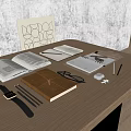 Open Brown Notebook and White Notebooks with Eyeglasses Watch Pencils Earbuds on Wooden Desk
