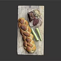 Fresh Braided Bread Served with Ham Walnuts and Cucumber Sticks on Wooden Board