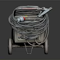 Old Metal Wheeled Industrial Equipment With Coiled Cables And Top Panel