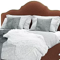 Textured Fabric Upholstered Brown Headboard Bed With Gray Pillows And Blanket