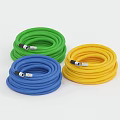 Colorful Coiled Green Blue Yellow Hoses with Metal Connectors Flexible Industrial Piping
