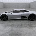 Sleek Silver Jaguar Sports Car In Modern Studio With Gray Floor And White Ceiling