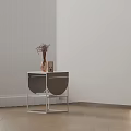 Modern Side Table with Metal Frame Curved Details and Decorative Vase Twigs in Minimalist Interior