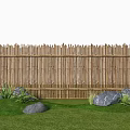 Decorative Garden Ornament Featuring Bamboo Fence Green Grass Rocks and Plants