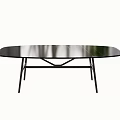 Black Oval Dining Table With Smooth Tabletop And Modern Metal Frame Design