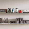 Modern Headphones and Speakers With Various Styles and Colors on Shelf