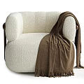Cream Colored Textured Fabric Armchair With Dark Brown Wooden Armrest And Brown Fringe Blanket