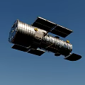 Hubble Space Telescope With Silver Exterior And Solar Panels In Orbit