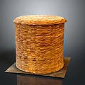 Brown Round Woven Storage Basket With Lid And Woven Texture On Mat
