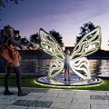 Butterfly Sculpture Photo Spot With Night Lighting And Waterfront View