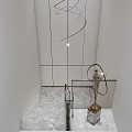 Modern Interior With Spiral Pendant Light Marble Staircase Glass Railing And Sculpture