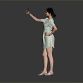 Woman Posing in Light Green Dress Taking Selfie with Mobile Phone Against Gray Background