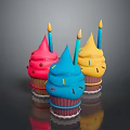 Colorful Cupcakes with Pink Blue Yellow Frosting Lit Candles and Sprinkles on Shiny Black Background