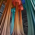 Colorful Art Installation With Flowing Column Structures In Red Orange Green And Blue Hues