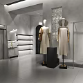 Modern Clothing Store Interior With Mannequins Displaying Dresses Clothes on Hangers and Display Table