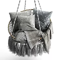 Cozy Sofa Stool Featuring Woven Frame Gray Cushions And Plaid Fringed Blanket