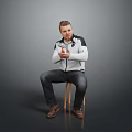 Man Sitting On Chair Clasping Hands In White Jacket Dark Pants And Brown Shoes Against Gray Background