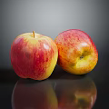 Fresh Ripe Red and Yellow Apples on Black Surface with Shiny Reflection