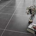 Gray Floor Tiles in Modern Room Setting with White Flowers Ferns and Open Books