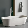 Freestanding White Bathtub with Silver Faucet Gray Wall Golden Light Strip and Hanging Gray Towel