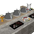 Modern Kitchenware Display With Black Chafing Dishes Trays And Condiment Cups On Marble Countertop