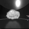 Large White Fluffy Art Installation Suspended In Dark Room With Person Interacting
