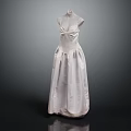White Sleeveless Long Dress with Pleated Design Displayed on Mannequin Against Dark Background