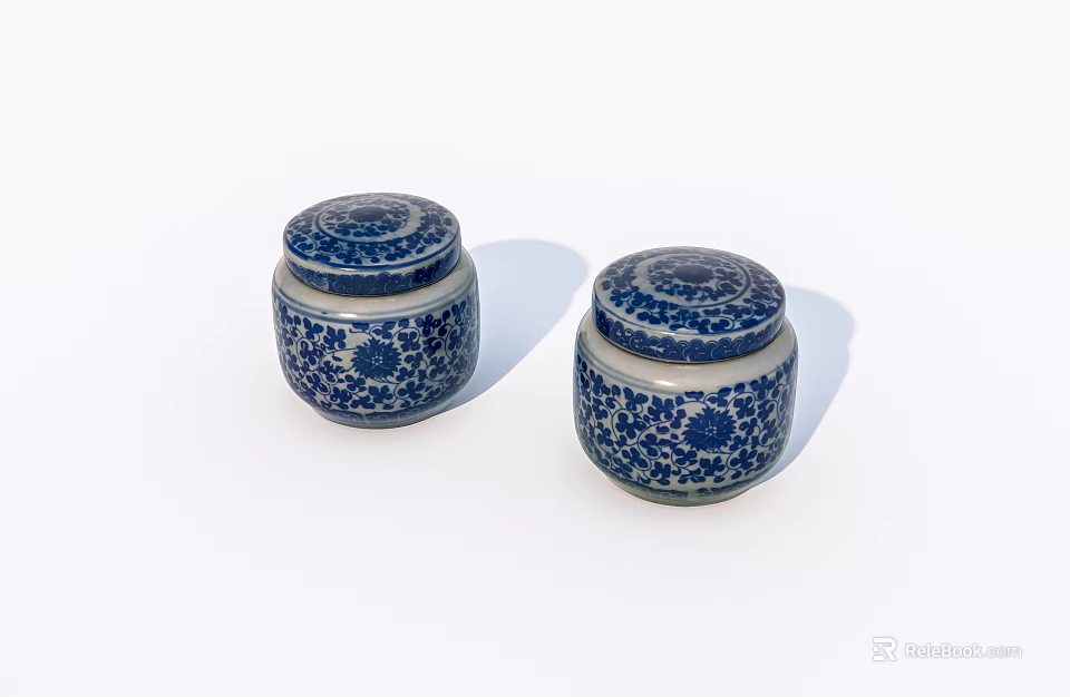 Two blue and white ceramic jars with floral pattern and lids 3d model