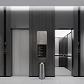 Modern Elevator Hallway With Dark Gray Walls Lighting Signage Glass Doors And Silver Trash Can
