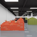 Warehouse Storage Area With Stacked Orange Black Green Boxes And Ceiling Lights White Walls