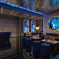 Modern KTV Lounge Interior with Blue Lighting Round Decor and Comfortable Sofas