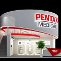 PENTAX MEDICAL Circular Exhibition Booth With Staircase Displayed Products And Reception Desk