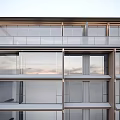 Modern Multi Storey Building Featuring Large Glass Windows Water Pool And Green Plants At Base