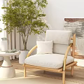 Stylish Single Sofa With Wooden Frame Beige Cushion Small Table Green Plant And Abstract Painting
