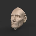 Man Head Sculpture Made of White Plaster with Detailed Facial Features on Dark Background