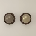 Round Wall Decor with Metallic Sphere and Brown Frame on Light Colored Wall 3d model