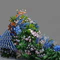 Colorful Flower Bouquet With Blue White Striped Wrapping Blue Bow Mixed Blooms And Green Leaves