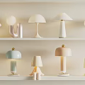 Modern Minimalist Table Lamps With Various Designs On White Shelves For Home Interior Decor