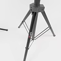 Two Black Speakers Mounted On Tripod Stands For Event Sound Setup
