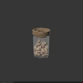 White Nuts Stored in Glass Jar with Wooden Lid on Dark Background