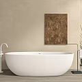 White Freestanding Bathtub In Bathroom With Beige Wall Brown Painting White Faucet And Wooden Floor