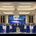 Banquet Hall Interior Design With Blue Chair Covers White Tablecloths Moon Stars Backdrop And Chandelier