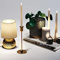 Elegant Table Lamp With Gold Base Cream Lampshade And Green Leaves Plant Candles On Books